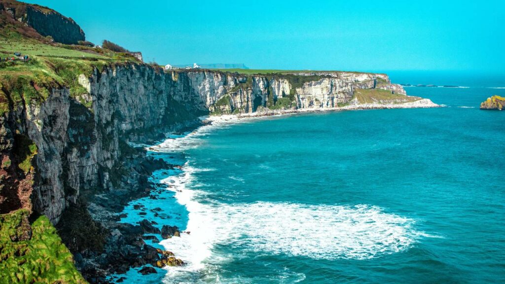 Coast of Ireland with green cliffs and blue sea