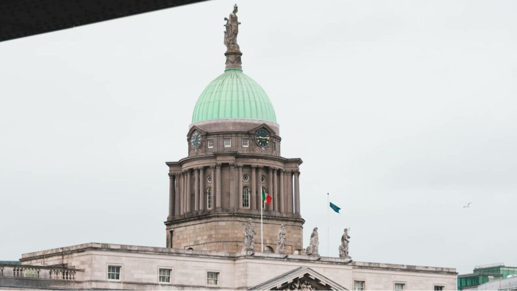 Government building with flags of Ireland and the European Union
